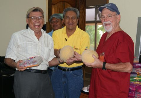 Doctors holding local proSymbolic Exchange of School Suppies and Melons Between  KHISH Project Vision and Agrrolibano Prinicipal Benefactorduce