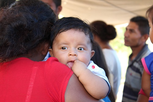 Child being held by mother